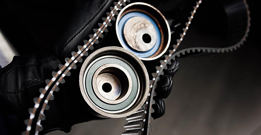 Mechanic inspecting timing belt at G&S Auto Care in Burnaby, BC