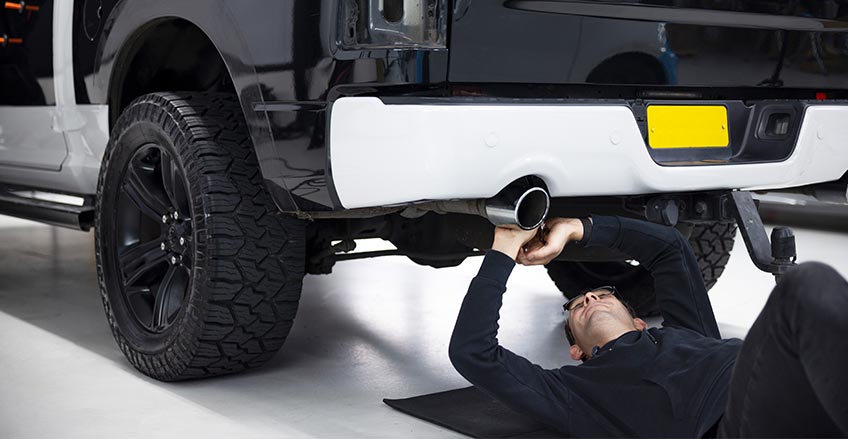 Skilled Technician Working on Truck